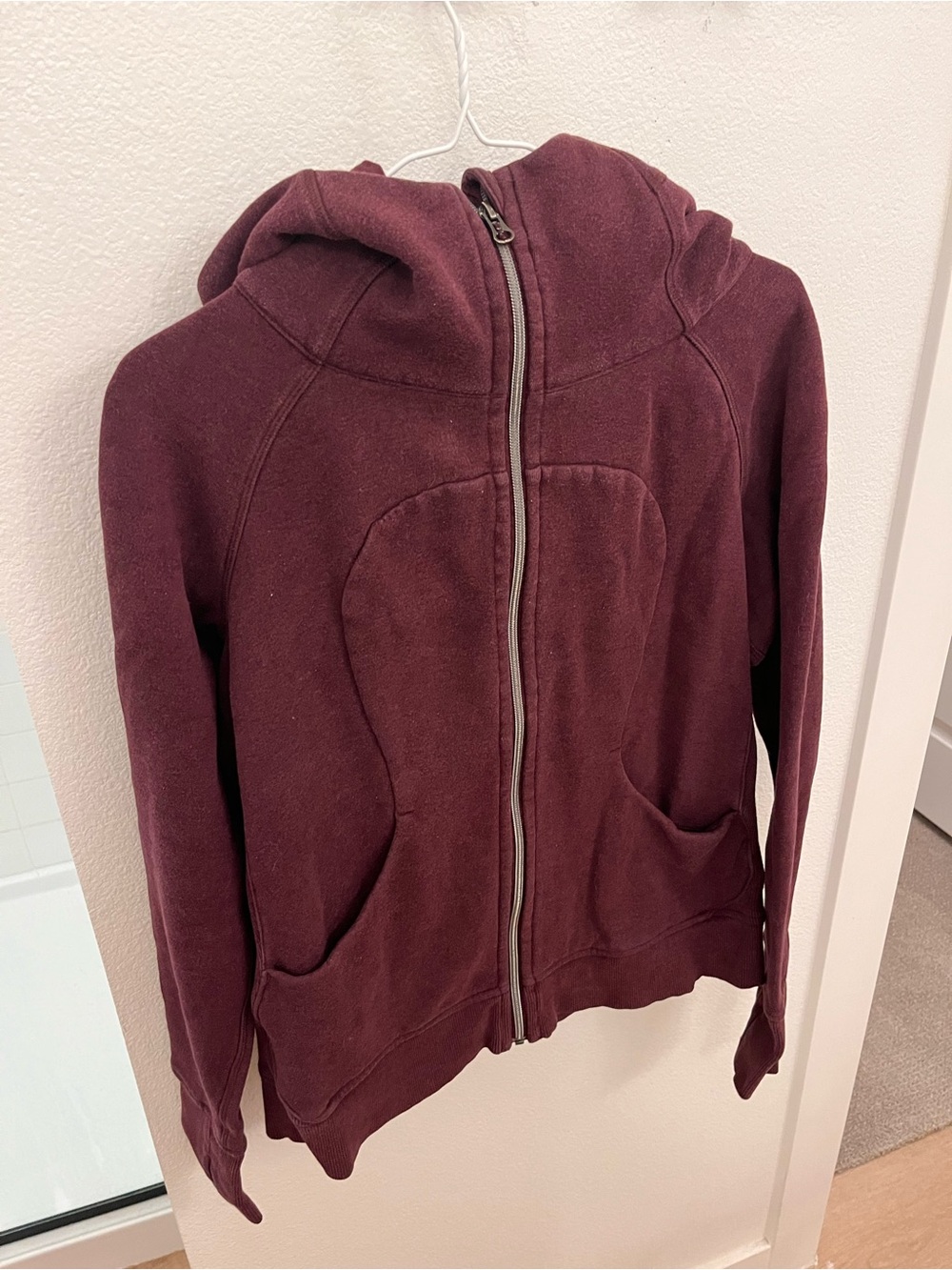 LULULEMON Burgundy Zip-Up Hoodie.There is no tag, but I believe it’s size Medium